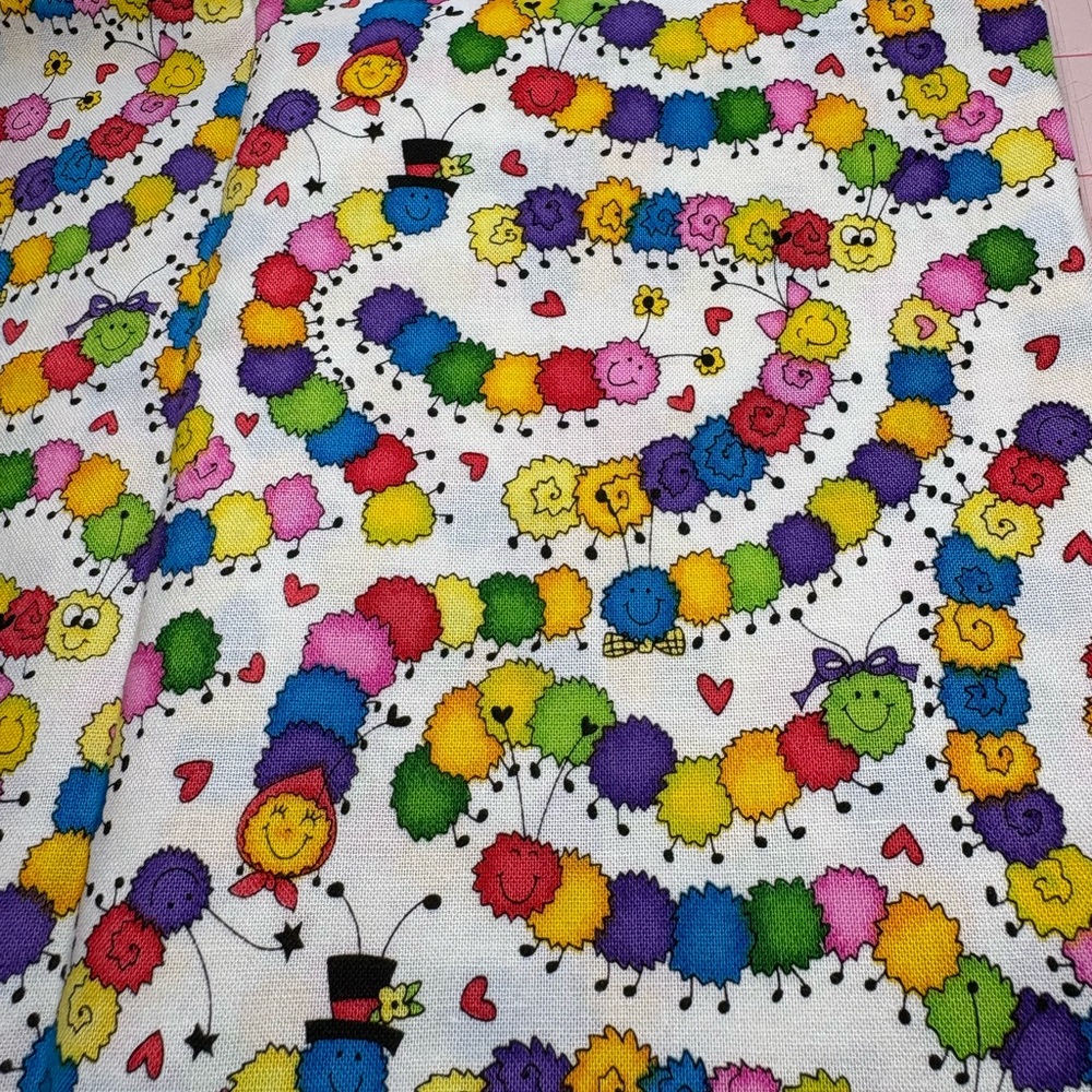 Rainbow caterpillars from the Kari Pearson Collection. 1/2 yard cut. Cotton
